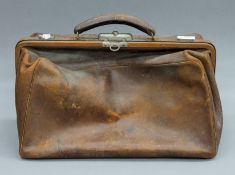 A 19th century leather Gladstone bag. 44.5 cm long.