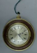 A 19th century mahogany and brass case Sedan clock. 18 cm diameter.