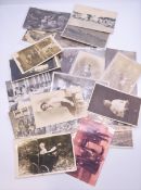 A quantity of vintage postcards, including WWI examples.