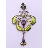 A silver Art Nouveau style pendant. 6 cm high.