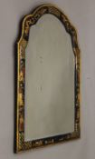 A late 19th/early 20th century chinoiserie lacquered wall glass. 66 x 93 cm.