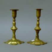 A pair of 18th century petal based candlesticks. 19 cm high.