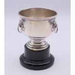 A silver miniature punch bowl trophy cup on stand. 10 cm high including stand.