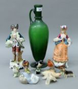 A quantity of porcelain figures, including Beswick and Lladro, and a green glass ewer.