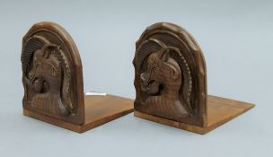 A pair of Eastern carved wooden bookends. 13.5 cm wide.