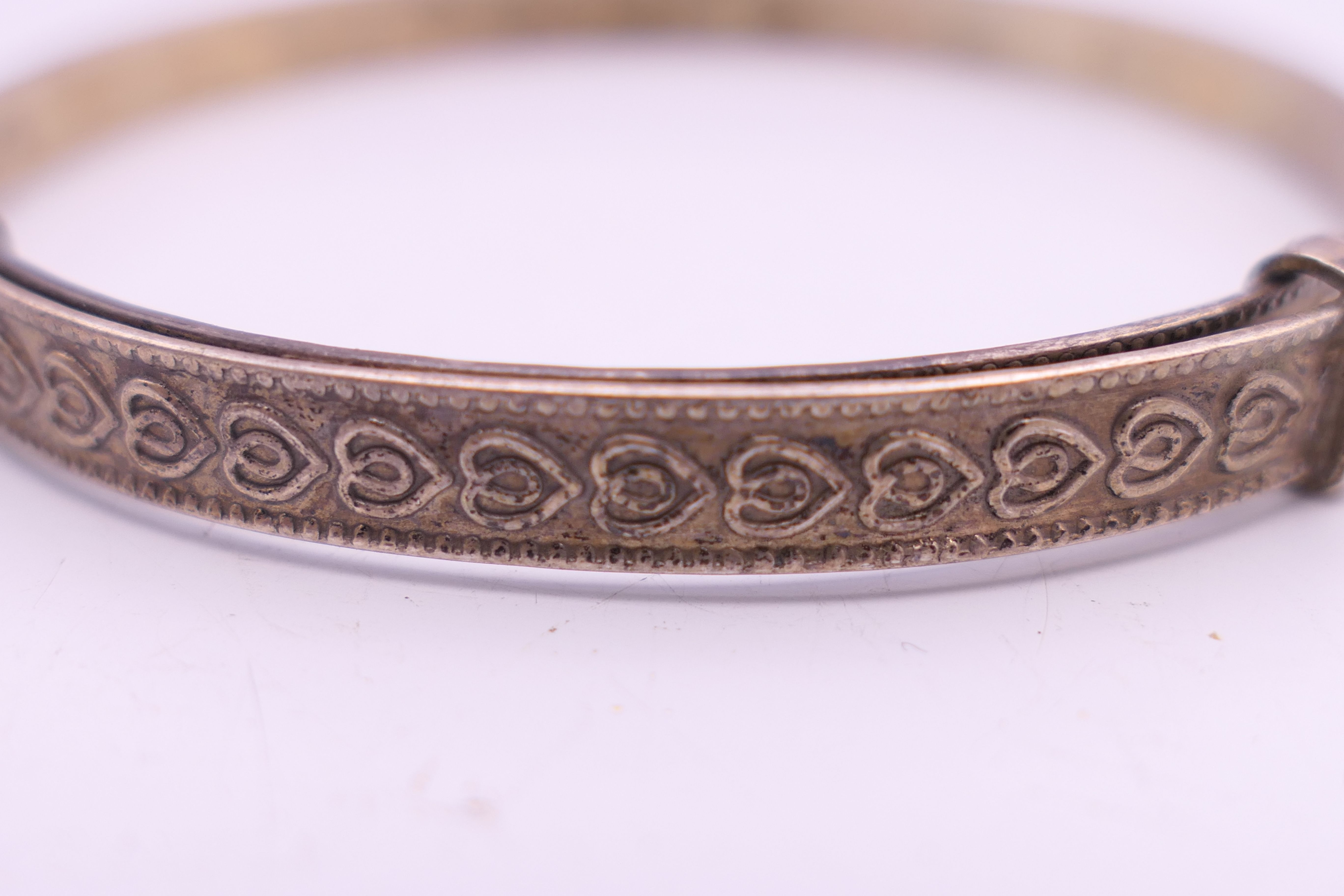 Four silver bangles. The largest 6.5 cm wide. 93.4 grammes. - Image 12 of 15