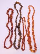 Four amber necklaces. The largest approximately 76 cm long.