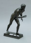 A 19th century patinated bronze model of a classical Greek athlete. 34 cm high.