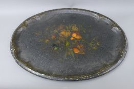 A florally decorated papier mache tray. 79 cm long.