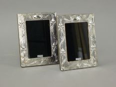 A pair of Art Nouveau style silver photograph frames. 14 x 18.5 cm.