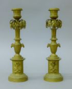A pair of 19th century Empire style brass candlesticks. 25.5 cm high.