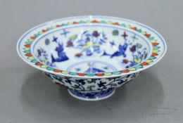 A Chinese porcelain bowl with blue painted six character mark to base. 14.5 cm diameter.