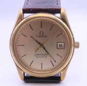 A gentlemen's gold plated Omega Seamaster Quartz wristwatch. 3.5 cm wide.