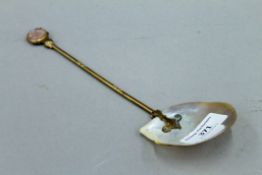 A 19th century mother-of-pearl mounted spoon. 22.5 cm long.