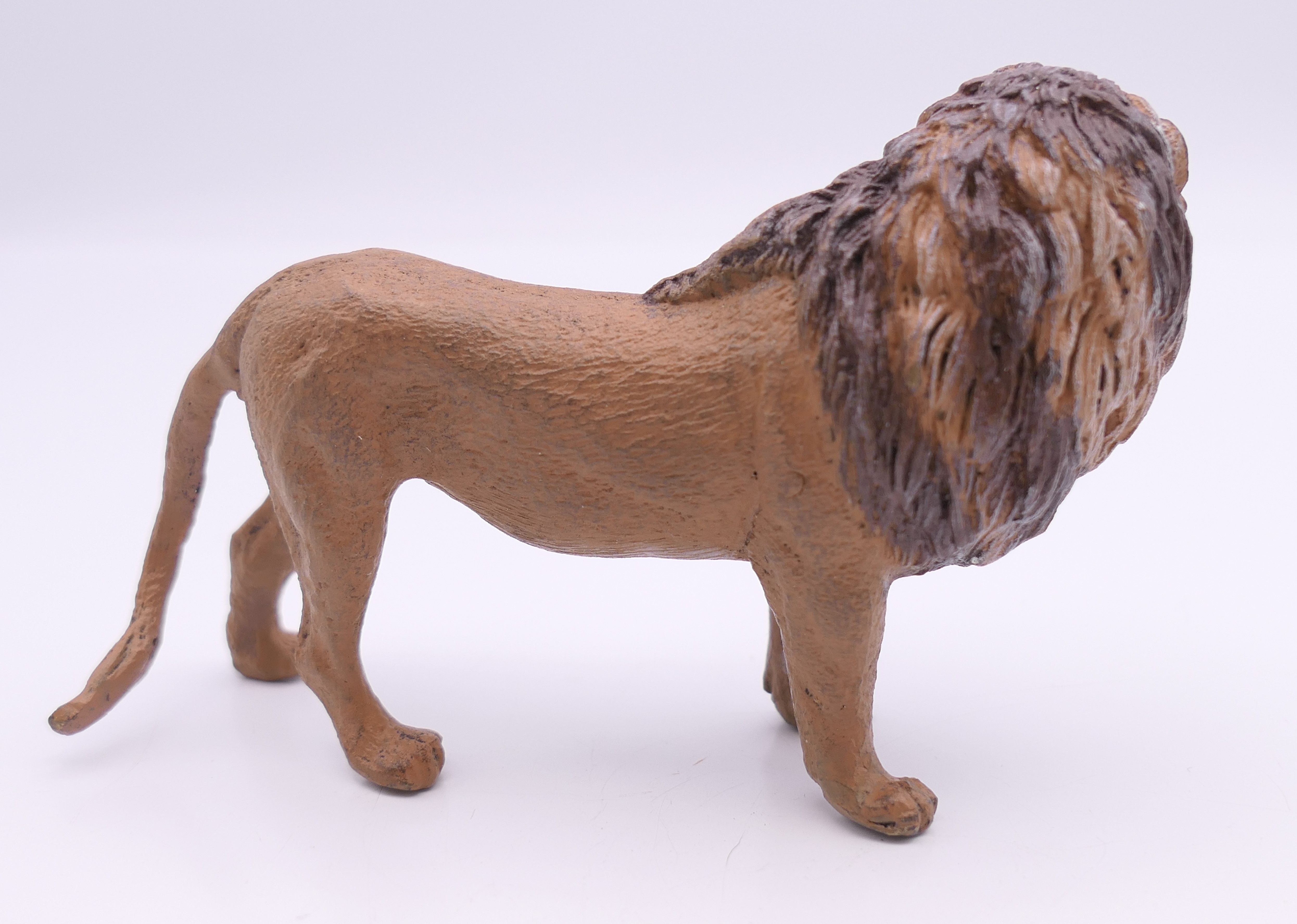 A cold painted bronze model of a lion. 9 cm long. - Image 2 of 4