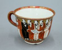 A 19th century Japanese hand painted porcelain cup. 7 cm diameter.