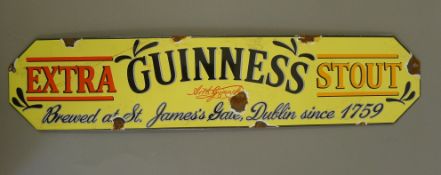 An enamel Guinness sign. 57 cm wide.