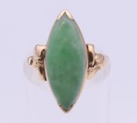 A 14 K gold jade ring. Ring size J. 3.1 grammes total weight.