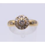 An 18 ct gold ring set with 0.5 carat of diamonds. Ring size L/M. 2.7 grammes total weight.
