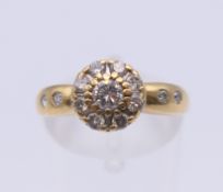 An 18 ct gold ring set with 0.5 carat of diamonds. Ring size L/M. 2.7 grammes total weight.