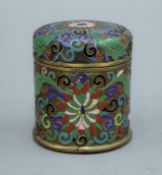 A late 19th/early 20th century cloisonne lidded box. 9.5 cm high.
