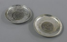 Two coin dishes. 9 cm diameter.