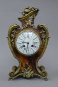 A late 19th century tortoiseshell mounted mantle clock. 37 cm high.