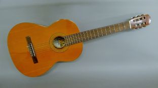 A Spanish flamenco classical guitar. 100 cm high.