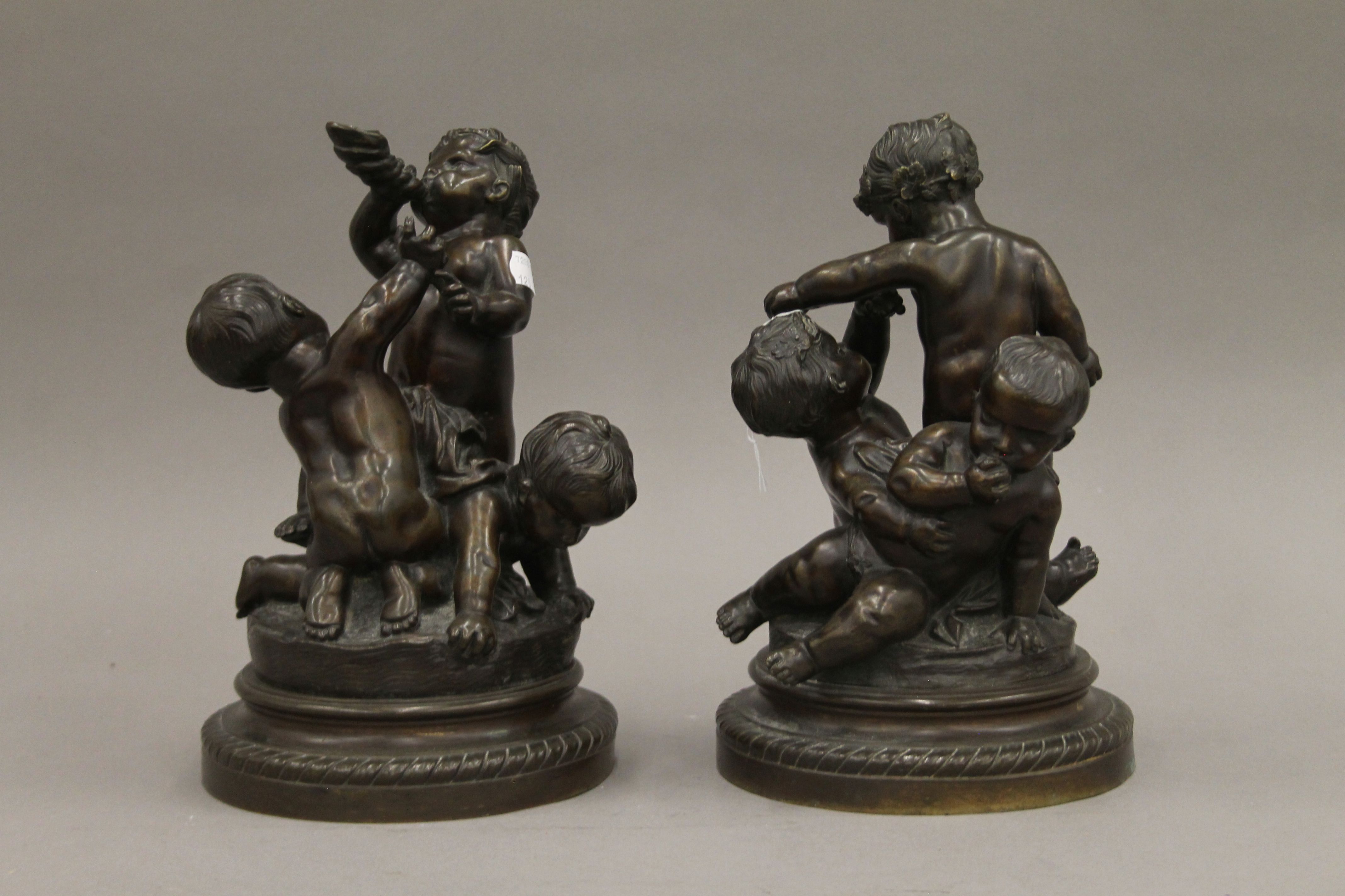 A pair of 19th century bronze sculptures of putti. Each approximately 28 cm high.