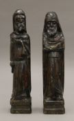 Two antique carved wooden figures. 36 cm high.