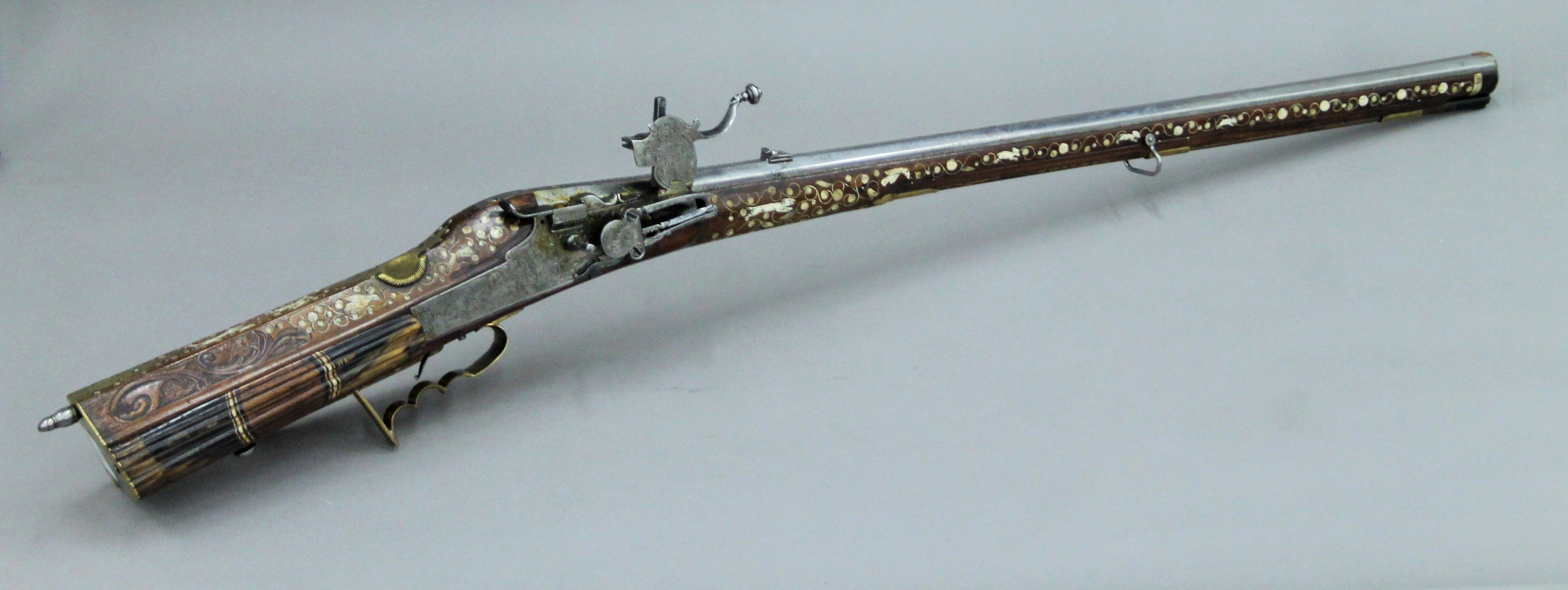 An antique Austrian wheel lock sporting rifle by Heinrich Aver. 117 cm long.