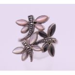 A silver dragonfly ring. Ring size P.