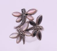 A silver dragonfly ring. Ring size P.