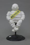 A cast iron Michelin man. 28 cm high.