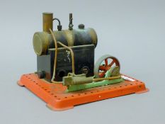 A Mamod stationery steam engine. 20 cm long.