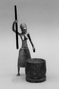 A bronze and wooden sculpture of an African woman. 21 cm high.