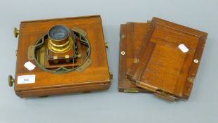 An Archer and Sons plate camera and two plates. 22.5 cm wide.