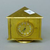 A combination clock, barometer and thermometer. 9.5 cm high.