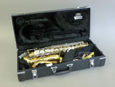 A cased Jupiter saxophone. The case 65 cm long.