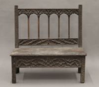 An antique carved oak solid seated bench, possibly 17th/18th century.