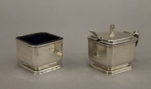 A silver salt and a silver mustard pot and spoon. 101 grammes.