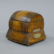 An oak barrel form music box. 12.5 cm high.