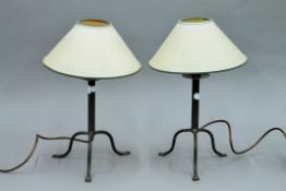A pair of wrought iron table lamps. 39 cm high overall.