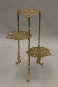 A brass three-tier stand decorated with butterflies. 77 cm high.