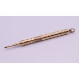 An unmarked 9 ct gold (tested) Samson Morden & Co propelling pencil. 9.5 cm long extended.