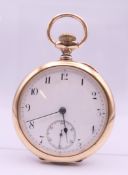 A Waltham gold plated open face pocket watch. 5 cm diameter.