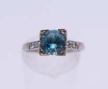 An 18 ct white gold and platinum diamond and topaz ring. Ring size M/N. 3.2 grammes total weight.