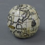 A bone globe compass.