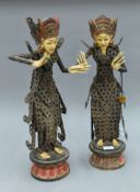 A pair of Balinese Kepeng figures. Each 56 cm high.