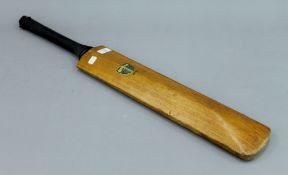 A vintage Gray Nicolls cricket bat. 83.5 cm long.